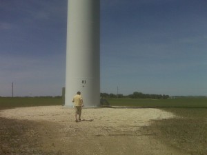 Bronson walking up to a wind farm thingy
